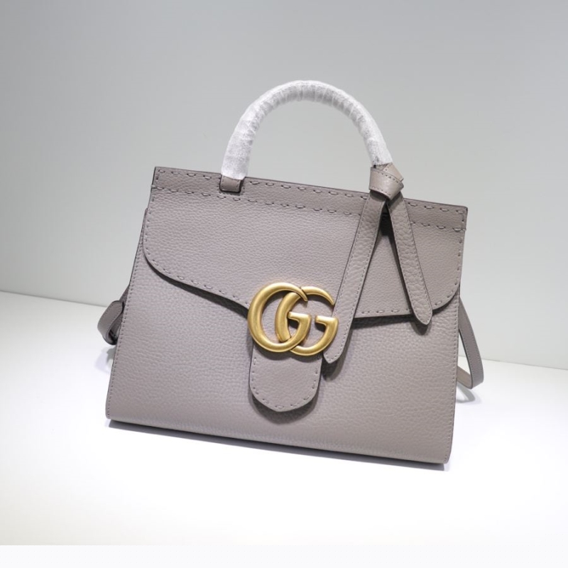 G*u*i top handle bags